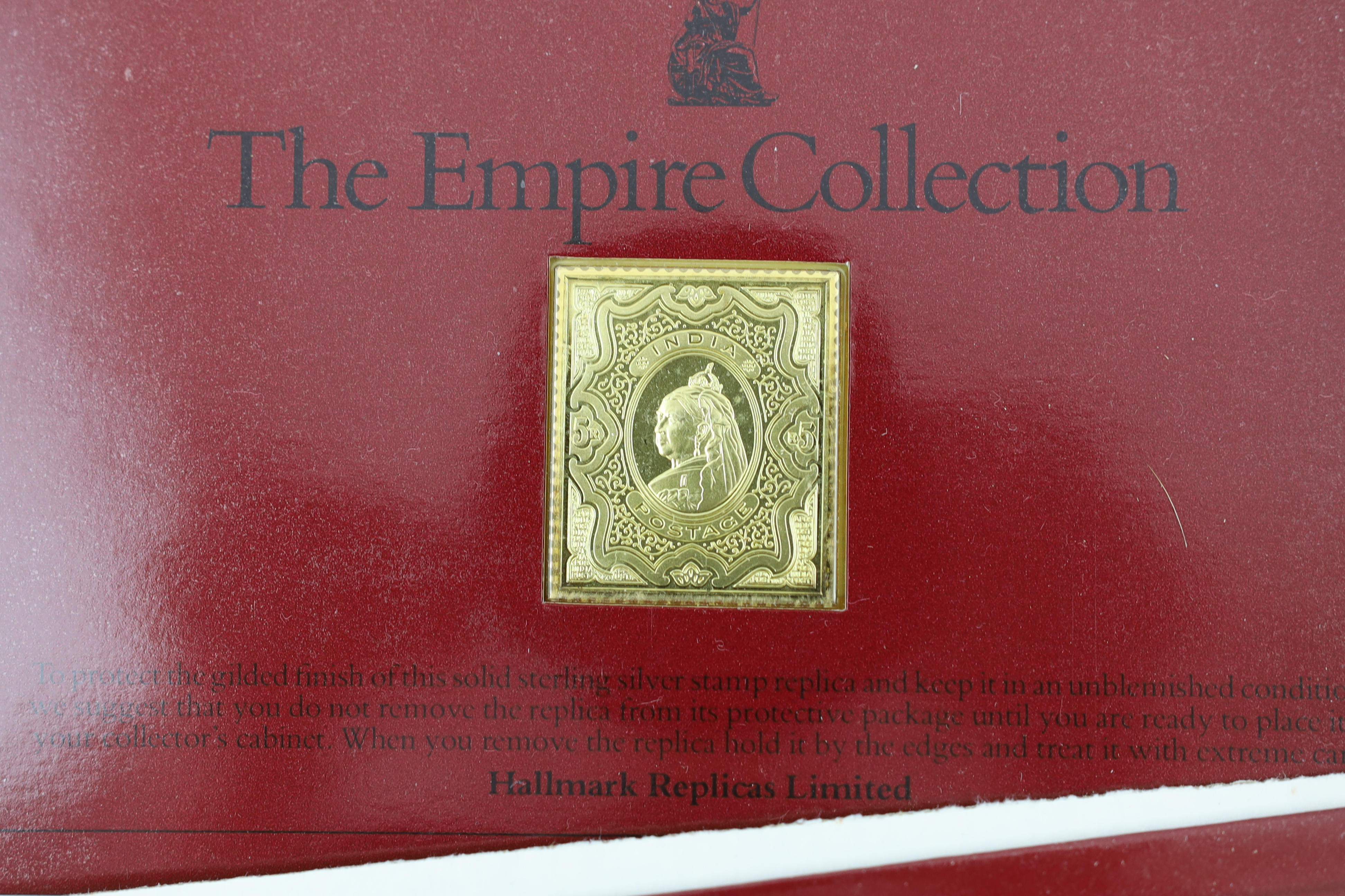 ‘The Empire Collection’, twenty five silver-gilt stamp replica ingots, in individual packets, approx. 471g